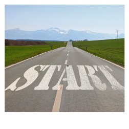 Road extending to the distance with the word start at the beginning