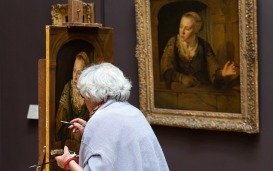 Elderly woman artist copying a masterpiece