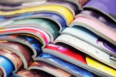 colorful pile of open magazine pages