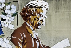 painting of Mark Twain holding a sheet of paper