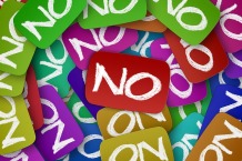 The word No, written in white on green, purple, red and other colorful squares